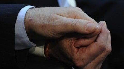 A-gay-couple-hold-hands-duing-their-wedding-ceremony-on-July-30-2010.-AFP