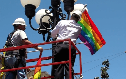 Kevin Faulconer Hoisting Pride Flag in Gaslamp Quarter