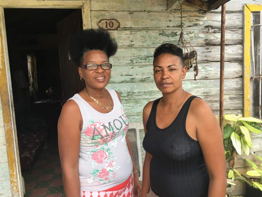 Argelia Fellové Hernández and her partner, Ana, are pictured outside their small home in the outer Havana neighborhood of Mantilla. Credit: Deepa Fernandes