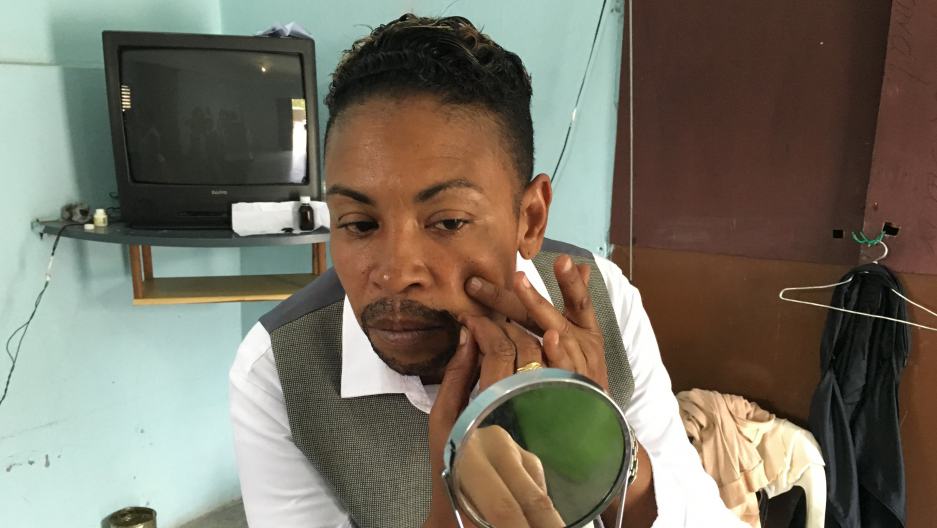 Ana, of the Cuarteto Habana, transforms to her male persona before a show at the Mantilla Cultural Center. Credit: Deepa Fernandes