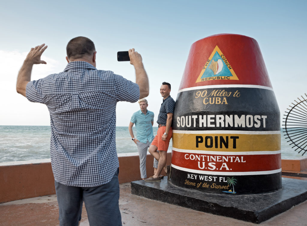 Key West's iconic Southernmost Point marker is a popular spot for a photo.