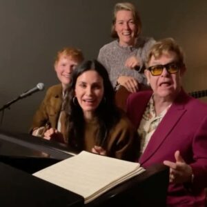Direct From Celebrity Dorm: Courteney Cox Plays Piano For Elton John -- 'Scariest, Most Nerve-Wracking' Thing'; Ed Sheeran, Brandi Carlile Join For Tiny Dancer. 4 490849 origin 1
