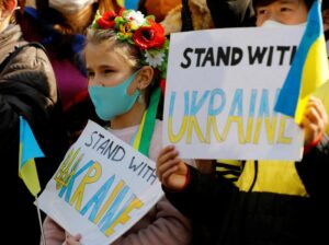 Waving Ukrainian flags, stop the war protesters rally around world 12 497481 origin 1