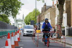 Cyclists in car frames protest 'absurdity' of vehicles hogging roads 7 525133 origin 1