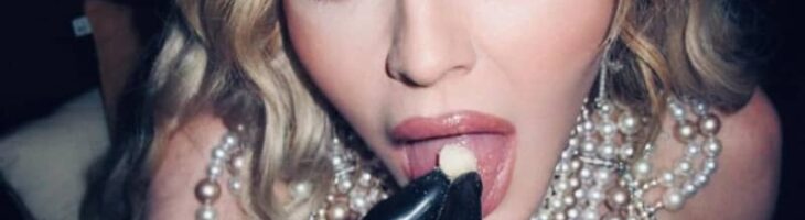 Madonna poses in leather corset and fishnets wowing fans with her ageless beauty